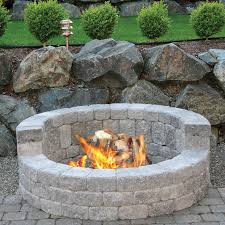 When purchasing bricks for the fire pit wall, go for something sturdy like retaining wall bricks or concrete pavers. Mutual Materials 58 In X 20 In Concrete Romanstack High Back Fire Pit Kit In Cascade Blend Ms58hbfp191 The Home Depot Fire Pit Kit Fire Pit Backyard Outdoor Fire Pit