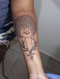 Its primary symbol or shield, is a tattoo featuring a rounded celtic cross, with different symbols in each of the quadrants of the cross. Black Power Tattoos Tattoos For Women Black Girls With Tattoos