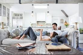 It was clear that some goals had to be achieved before others. Young Couple Relaxing On Sofa Looking At Mobile Phone After Work By Trinette Reed Couple Home Stocksy United