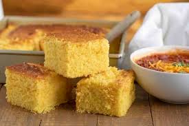 Cornbread salad with corn bread, chopped green chilies, undrained, ground cumin, dried oregano, rubbed sage, mayonnaise, sour cream, dressing, bacon, pinto beans, whole kernel corn. Ultimate Cornbread Dinner Then Dessert