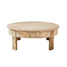 One coffee table with distressed details. Carved Solid Mango Wood Round Coffee Table Manilal Maisons Du Monde