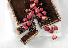 The base is made from a combination of oats, almonds, sweet and sticky dates, and coconut, meaning it is gluten free and free from refined. Recipe Date And Coconut Crusted Dark Chocolate Tart