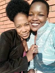 Can someone edit this photo to look like my mom is hugging me?