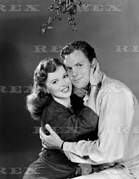 Shirley temple was a leading child film actress during the great depression, starring in works like bright eyes and captain january. Shirley Temple With Husband John Agar Under The Mistletoe 1948 1948 Shirley Temple Black Shirley Temple Old Movie Stars