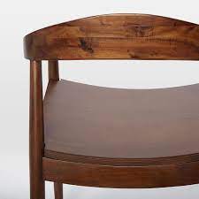 This solid poplar chair has elegant curves, delicate legs, and would look good around just about any table you could imagine. Lena Mid Century Dining Armchair West Elm Mid Century Dining Armchair Home Decor Modern Furniture