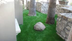 While mature trees bring shade and beauty to a residential landscape, the ground around their trunks can become a barren blight. How To Lay Artificial Grass If You Have Trees