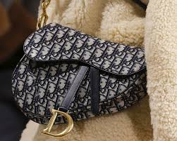 The space between the edges and the white outline is larger. How To Spot A Fake Christian Dior Saddle Bag Brands Blogger