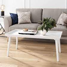 The combination of wooden legs and white metal wires not only add to the aesthetic value, but provide stability for use in a variety of environments. Amazon Com Nathan James Hazel Mid Century Wood Tray Top Coffee Table With Narrow Cone Legs And Modern Veneer Finish White Furniture Decor