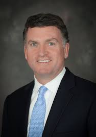 Athens banker to serve