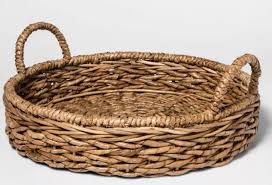 Seagrass adds a classic texture and rustic charm to your home and these round trays have a deep rim so they can double up as bowls or baskets. Chunky Seagrass Woven Serving Tray Beige Threshold Coffee Table Decor Tray Wicker Tray Woven Trays