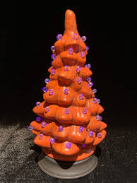 It is decorated with a blend of light orange and orange twist light bulbs. 8 Ceramic Halloween Trees You Can Shop Right Now Popsugar Home