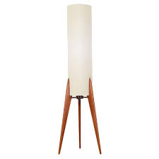 Danish modern tables and chairs, desks and dressers, and other types of furniture from the postwar period are recognizable for their simple, elegant, and airy forms. Danish Modern Tripod Teak Table Lamp At 1stdibs