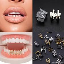 Polished diamond cut white gold teeth. 2021 Gold White Gold Iced Out A Z Custom Letter Grillz Full Diamond Teeth Diy Fang Grills Bottom Tooth Cap Hip Hop Dental Mouth Teeth Braces From Guozhuwu 8 86 Dhgate Com