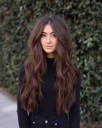 Loose curls with straight fringe. 21 Flattering Middle Part Hairstyles Trending For 2021
