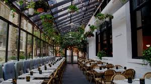 Barclay prime's elegant private dining room — paneled in dark wood with the restaurant's signature. Osteria