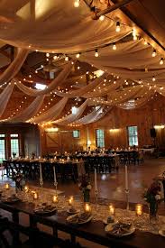 Arrow signs help your guests to find their way around easily and they're just cute! 30 Rustic Barn Wedding Reception Space With Draped Fabric Decor Ideas Rustic Barn Wedding Reception Barn Wedding Reception Wedding Ceiling