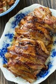 The pork will continue to cook after you take it out of the oven and the juices will redistribute within the meat.8 x research source. Bacon Wrapped Maple Glazed Pork Loin Spicy Southern Kitchen