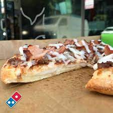 Domino's wafer thin base is crispy all the way through and keeps its crunch to the very last bite. Facebook