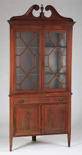 A chic antique corner china cabinet of natural stained oak wood (including back wainscotting). Antique Georgian Style Mahogany Corner Cabinet Worthington Galleries Part 1