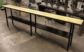 Its asymmetrical structure allows it to slide over a couch or chair. Long Side Table Whetstone Workshop