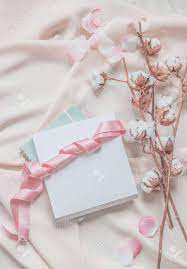 Sounds perfect wahhhh, i don’t wanna. Aesthetic Lifestyle With Notebook White Box And Pink Ribbon On Beige Fabric Background With Cotton Branches And Pink Petals Top View Beauty Stock Photo Picture And Royalty Free Image Image 163962880