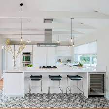For a kitchen lacking a lot of square footage, you can opt for a rolling kitchen island or small kitchen islands—these can add additional surface and storage space without taking up more precious space. We Ve Chosen Our 48 Favorite Kitchen Designs From Traditional To Modern Elegant To Cozy And Casual Thes Kitchen Layout Kitchen Designs Layout Kitchen Design