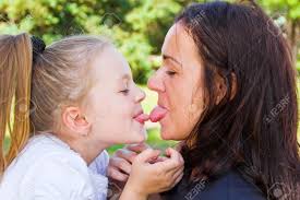 Photo Of Kissing Mother And Daughter In Summer Stock Photo, Picture and  Royalty Free Image. Image 33062254.