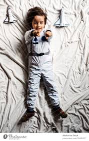 Browse a variety of housewares, furniture and decor. Boy In Astronaut Costume Lying On Bed A Royalty Free Stock Photo From Photocase
