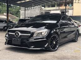 A thick arrow pointing up and to the right. Angus Mair Black Mercedes Benz Cla 250