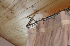 You can use it as a room divider or even as a bed canopy to change up the look of your bedroom or another room in your home. How To Mount Curtains On Slanted Ceiling Curtain Rods Bay Window And How To Install Ce Ceiling Mount Curtain Rods Shower Curtain Rods Ceiling Curtain Rod