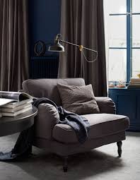 When we talk about reading chairs, we mean seats that promote relaxation, security and protection from the demands of the world outside your book (including the harsh demands of gravity). A Reading Area With An Armchair Floor Lamp And Table Lounging Around In Your Hotel Style Bedroom Bedroom Seating Area Hotel Style Bedroom Living Room Sofa