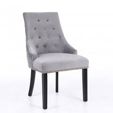 These velvet dining chairs work are perfect for a contemporary dining room. Neo 2x Studded Velvet Dining Chair With Ring Knocker Detail