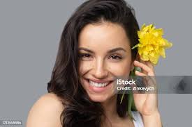 Woman Holding Yellow Daffodils Stock Photo