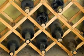 My kitchen has a narrow upper cabinet with cubbies that look like they would fit wine bottles. 10 Free Wine Rack Plans Lovetoknow