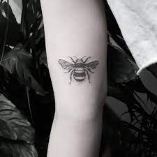 Small Black And Grey Bee Tattoo On The Right Arm Bee Tattoo Black Ink Tattoos White Tattoo