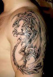 The Human That Stands Above God S Tattoos For Men On Shoulder Dragon Tattoos For Men Dragon Tattoo