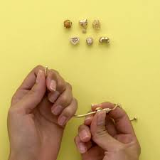 Holding the open jump ring (with the charm attached) in one pair of pliers, pick up the bracelet and slide the desired chain link onto the jump ring. Pandora How To Wear The New Pandora Sliding Bracelet Facebook