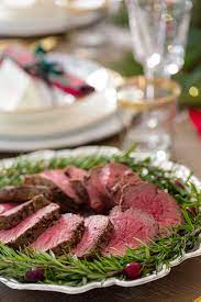 I thinly sliced an onion and smashed 3 cloves of garlic. Christmas Dinner Rosemary Peppercorn Beef Tenderloin Roast Pizzazzerie