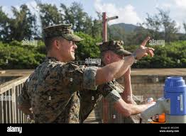 U.S. Marine Staff Sgt. Brett Tate, company gunnery sergeant, Headquarters  Company, Headquarters Service Battalion, U.S. Marine Corps Forces, Pacific,  observes the marines participating in the leadership reaction course at  Landing Zone Boondocker,