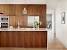Natural Walnut Kitchen Cabinets With Blue Cabinets