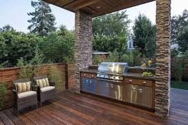 Adding an outdoor kitchen design to a deck's layout takes careful planning as an outdoor space can be limited but enhanced by this al fresco cooking amenity. 50 Enviable Outdoor Kitchens For Every Yard