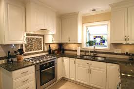 This kitchen by urrutia design features a highly composed mix of colors and textures. Off White Kitchen Cabinets With Black Granite Countertops Novocom Top