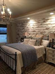 Wood is a perfect way to add character to any room of your home and the natural look is very on trend in the interior design department. Love This Distressed Wood Accent Wall In The Master Bedroom Master Bedroom Accents Wood Accent Wall Bedroom Farmhouse Bedroom Decor