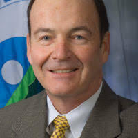 John Wentling, Honorary Marine, listens as he finds