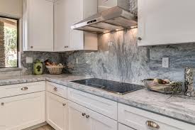 Kitchen With Arabescus White Marble Counter With Gray Streaks And White Cabinets Gray And White Kitchen White Marble Kitchen Kitchen Marble