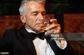 Wealthy Man Drinking Brandy Stock Photo