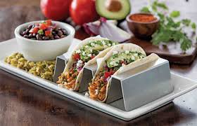 The fish—we use cod, but any flaky variety works—marinates in a mixture of lime juice, chili powder, and cumin that will become your standard. Fresh Mex Chilis