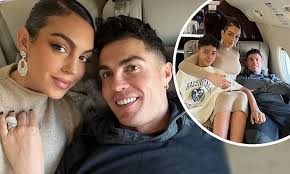 Georgina Rodriguez relaxes with Cristiano Ronaldo and Cristiano Jr as they  board a private jet