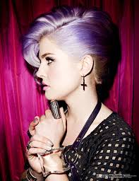 Kelly's hair was parted down the middle and braided close to her head from her temples toward the crown. Photo Why 27 Year Old Kelly Osbourne Dyed Her Hair Grey