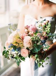 Balance the colors by using them in an unpredictable way, like on your table cloth, while choosing neutrals for your flowers. Colorful Bridal Bouquet With Pink Blush Dusky Blue And Light Yellow Flowers For A Wedding I Blue Wedding Flowers Yellow Wedding Flowers Wedding Bouquets Pink